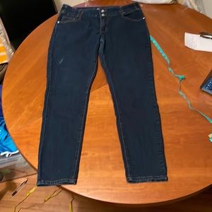 Deep blue skinny jeans with rhinestones.